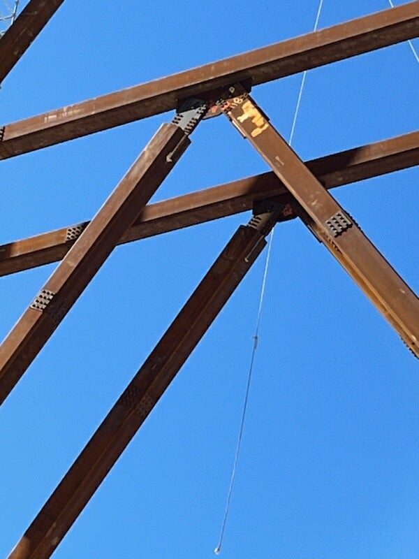 an HSS truss connection utilizing the Shuriken Structural Nut Keeper